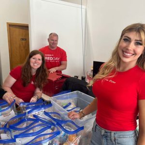 KW Greater 360 Agents packing food for StandUp For Kids Kitsap