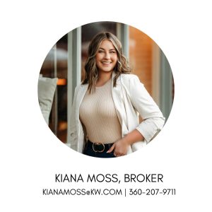 Girl with wavy blond hair to her shoulders, wearing a cream blazer and white top, posing for the camera with her hand in her pocket.
